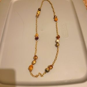 Necklace gold colored yellow and red balls